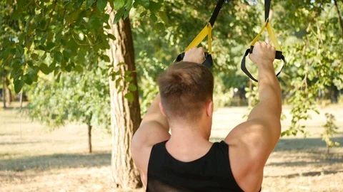 The training outdoors in the trx Stock Footage 114314959