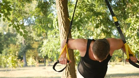 The training outdoors in the trx Stock Footage 114314967