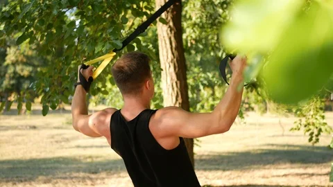 The training outdoors in the trx Stock Footage 114314977