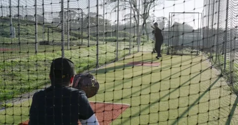 Training partners winding up, throwing baseball and securing ball in mitt Stock Footage 339160921