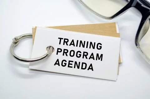 Training Program Agenda on notepad with keyring Stock Photos
