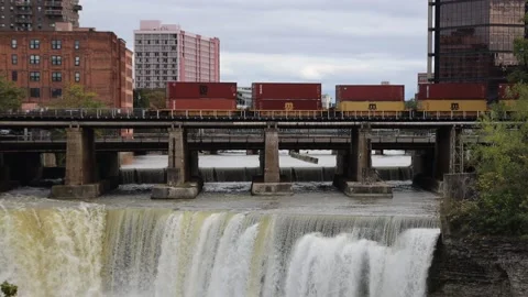 Training rolling over waterfall in Downtown Rochester New York Stock Footage 163834178