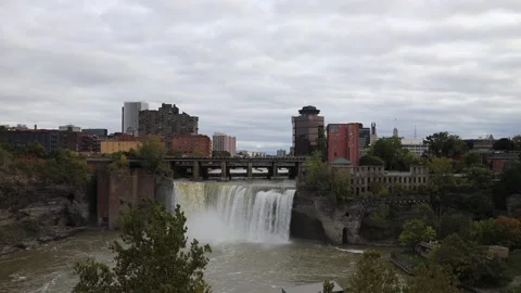 Training rolling over waterfall in Downtown Rochester New York Stock Footage 163834181