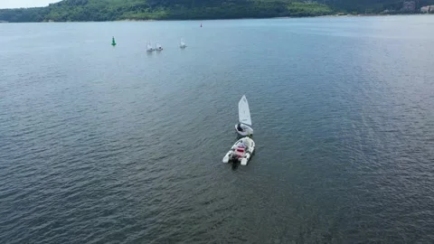 Training sailing yachts class optimist float on the sea Stock Footage 176684646