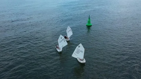 Training sailing yachts class optimist float on the sea. Stock Footage 237915086