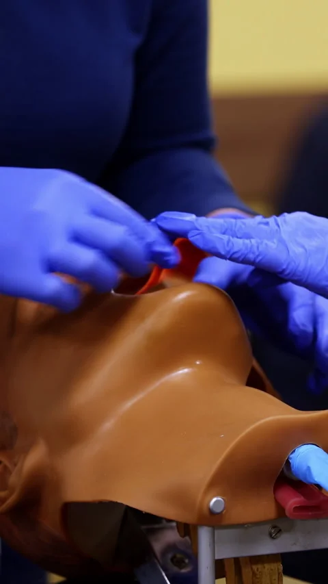 Training skills on dummy's head.  Stock Footage 284417942