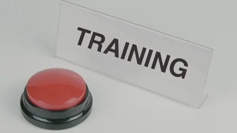 Training text or word displayed on a nameplate as a hand presses a button Stock Footage 307207072