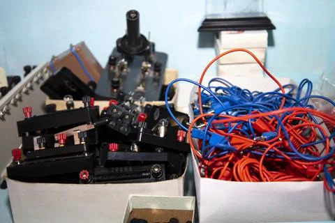 Training tools voltmeter and wires for conducting experiments. Stock Photos