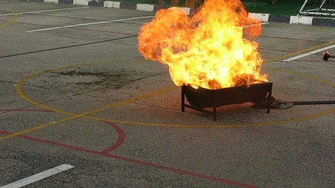 Training of using fire extinguisher to put off fire Stock Footage 103604546