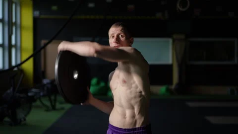 Training Utilizing Diverse Weight Disc Movements for Comprehensive Workouts Video stock 305143358