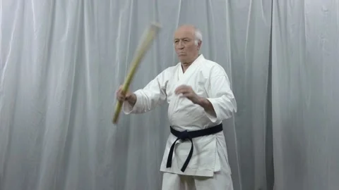 A training video of stick techniques performed by an athlete Stock Footage 130543544
