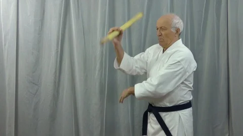 Training video of stick training performed by an old athlete Stock Footage 129774628