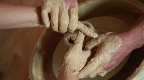 Training to work on the potter's wheel Stock Footage 65186392