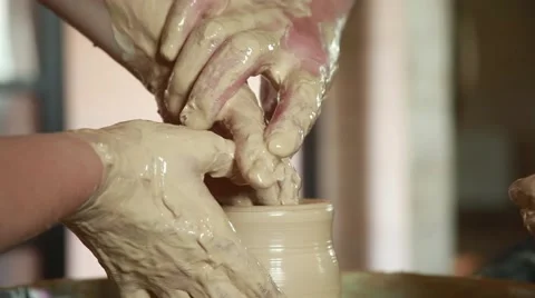 Training to work on the potter's wheel Stock Footage 65186397