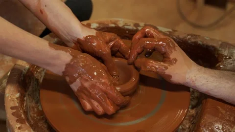 Training for work in the potter's wheel. A man and a woman work together with 스톡 동영상 155754159