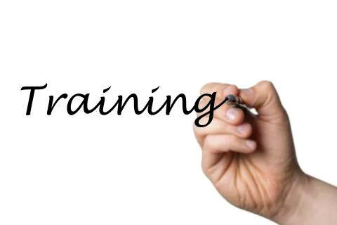 Training written by a hand Stock Photos
