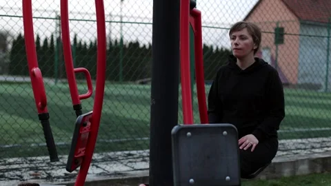 Training in the yard on simulators. The girl is losing weight Stock Footage 270432600