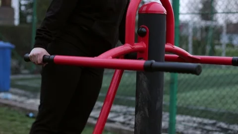 Training in the yard on simulators. The girl is losing weight Stock Footage 270432696