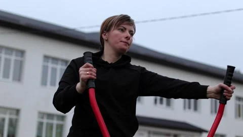 Training in the yard on simulators. The girl is losing weight Stock Footage 270433317