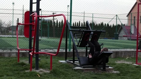 Training in the yard on simulators. The girl is losing weight Stock Footage 270433335