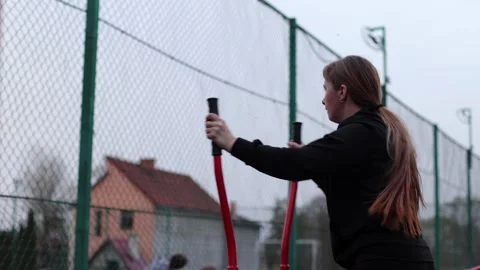 Training in the yard on simulators. The girl is losing weight Stock Footage 270433354