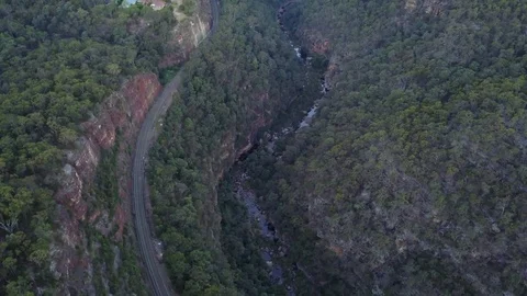 Trainline Running Through Mountainess Bushland Stock-Footage 80904422