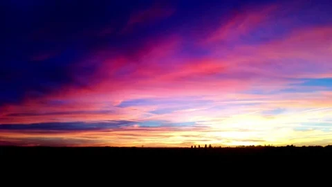 Trainride during sunset, seen from a window in the train Video stock 98679787