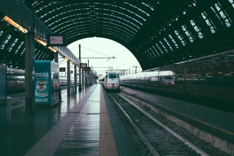 Trains are waiting of departure inside of Milano Centrale Stock Photos