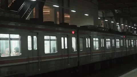 Trains arrive at the station at night Stock Footage 254068977