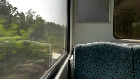 Train's empty window seat move through countryside in Berlin, Stock Footage 139316855