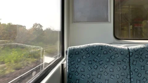 Train's empty window seat move through countryside in Berlin. Stock Footage 139429037