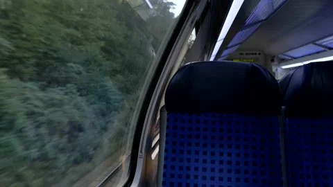 Train's empty window seat move through countryside in Dresden. Stock Footage 139429197
