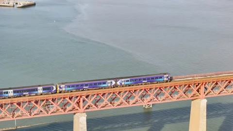 Trains on Forth Bridge from a drone, Forth Estuary, Scotland Stock-Footage 317307564