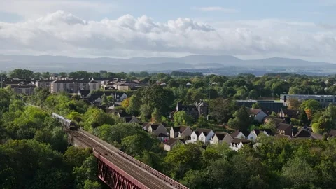 Trains on Forth Bridge from a drone, Forth Estuary, Scotland Stock-Footage 317307605