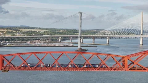 Trains on Forth Bridge from a drone, Forth Estuary, Scotland Stock-Footage 317307606