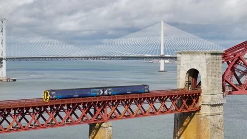Trains on Forth Bridge from a drone, Forth Estuary, Scotland Stock-Footage 317307988