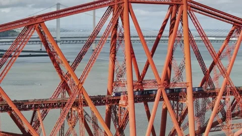 Trains on Forth Bridge from a drone, Queensferry Crossing, Scotland Stock-Footage 317099754