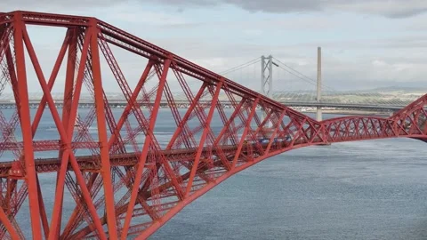 Trains on Forth Bridge from a drone, Queensferry Crossing, Scotland Stock Footage 317099759