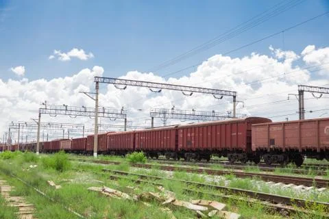 Trains with goods and freight cars are on the railway Stock Photos