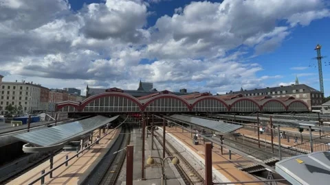 Trains passing by Copenhagen main train station  Stock Footage 158999957