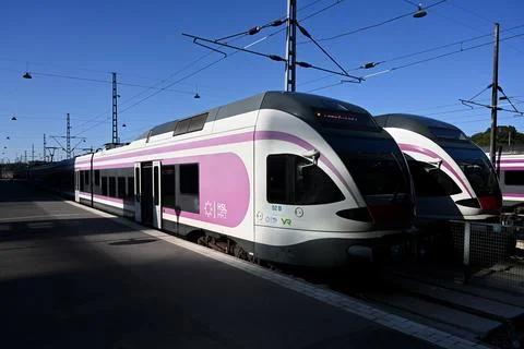 A trains on the platform on Helsinki Central Train Station. Stock Photos