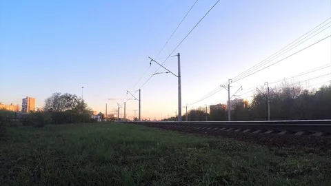 Trains on rails at sunset in spring timelapse Vidéo 82982108
