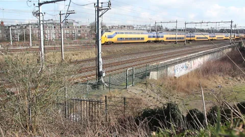 Trains in a residential area Stock Footage