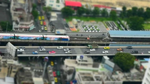 Trains run in and out of the platform. and traffic on expressways Stock Footage 246346018