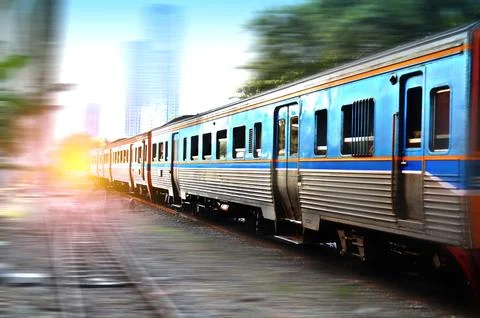 Trains running on the tracks in the evening Stock Photos
