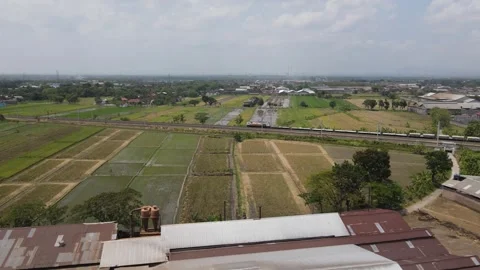 Trains speeding down the track followed by drones in the air Stock Footage 259931786