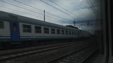Trains in transit alongside Stock Footage 133455614