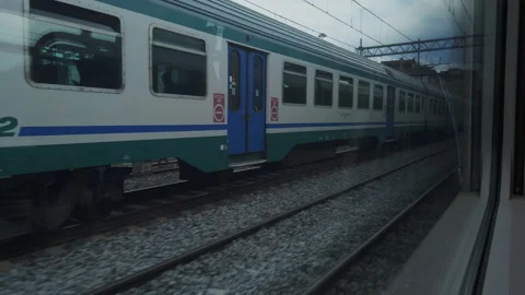 Trains in transit alongside Stock Footage 133456101