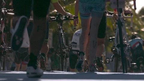 Traithletes Running with Bikes in Slow Motion Stock Footage 82879729