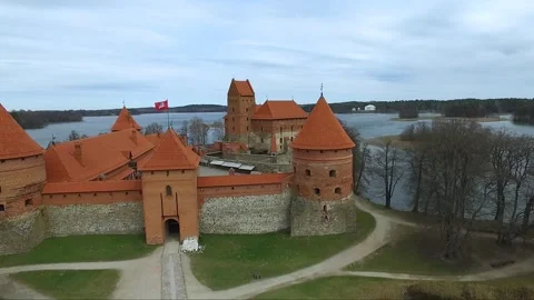  Trakai Island Castle in Lithuania on a cloudy day with views of the surrounding Stock Footage 328909998